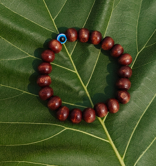 "Handcrafted Wooden Bead Bracelet with Evil Eye Charm"